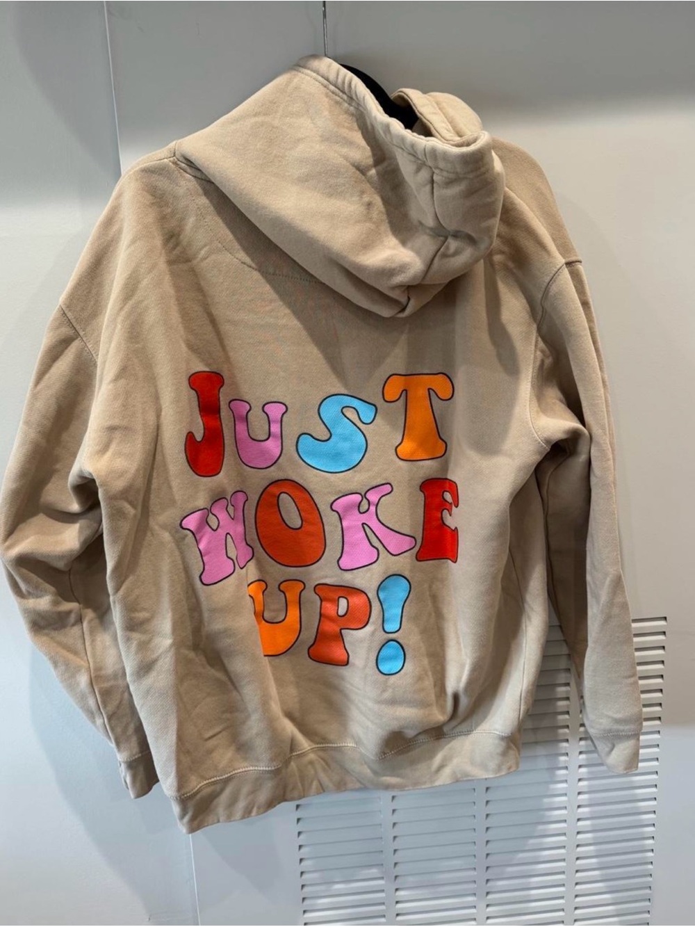Relaxed Beige Pullover Hoodie with Subtle Chest Graphic